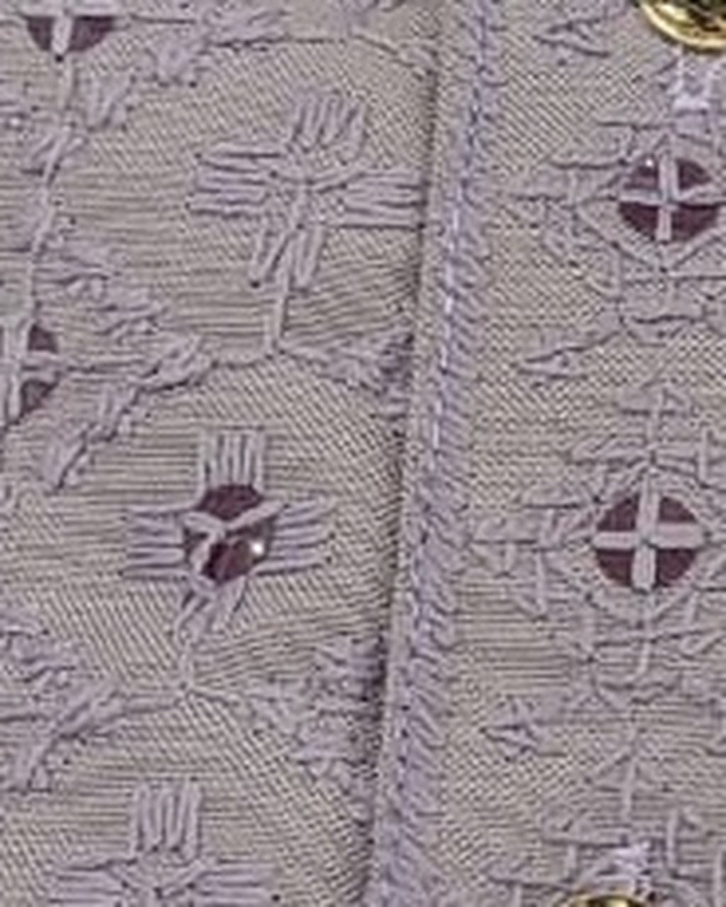 Lilac thread and sequin fabric close-up, real photograph